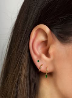 "The tiniest little studs for the most understated sparkle. Simple and dainty, they're perfect for layering with other dainty hoops and studs when you have multiple piercings. ∙ Available with emerald green, blue or purple cz stones. All options are available on the dropdown menu. ∙ Sold individually (1 stud) or by pair (2 studs) PLEASE NOTE - These are very tiny. * D E T A I L S * ∙ Material:  .925 Sterling Silver or 18K Gold Plated over .925 Sterling Silver  ∙ Stone: Green, Blue or Purple cz s Stacked Lobe Ear Piercings Simple, Two Hole Earring Ideas, Earring Two Holes, Three Ear Lobe Piercings, Blue Ear Piercings, Third Hole Piercing, Minimalist Huggie Birthstone Earrings, Minimalist Birthstone Huggie Earrings, Minimalist Everyday Huggie Earrings With Birthstone