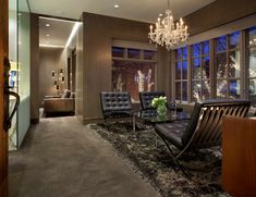 a living room filled with furniture and a chandelier