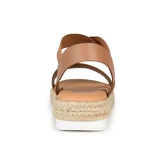 Enjoy the warm weather in the Caroline by Journee Collection. This strappy sandal features elastic uppers for a flexible fit and a 7 mm Tru Comfort Foam� footbed for added support. A walkable sliver wedge heel wrapped in espadrille perfects the design. At Journee Collection our sandal styles are going to be perfect for any occasion. Whether that be a formal business or casual dress these sandals will be a perfect match. Brown Synthetic Sport Sandals For Summer, Summer Slingback Wedge Heel Sandals With Heel Loop, Wedge Heel Slingback Sandals For Summer, Brown Sport Sandals For Spring Beach Occasion, Summer Slingback Wedge Sandals In Synthetic, Synthetic Slingback Wedge Sandals For Vacation, Strappy Sandals With Removable Insole For Vacation, Beach Footbed Sandals With Arch Support And Ankle Strap, Beach Ankle Strap Footbed Sandals With Arch Support