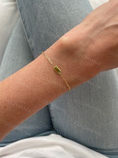 "All Our Bracelets Are Made Of REAL 14K GOLD  14K Yellow Gold Peridot Paperclip Link Chain Bracelet with Lobster Clasp, 7\" Inch, Real Gold Bracelet, Birthstone Bracelet, Women  Shop our 14K Bracelets https://www.etsy.com/shop/GOLDMANIA?ref=seller-platform-mcnav§ion_id=26925987  Shop On Sale items https://www.etsy.com/shop/GOLDMANIA?ref=seller-platform-mcnav§ion_id=1  Metal: 14K Yellow Gold   Width: 1.5 MM  Length: 7 IN  Closure: Lobster claw Weight: 2.50 Gram   Gemstone type: Peridot Gemstone s Modern Jewelry With Rectangular May Birthstone, Modern Rectangular May Birthstone Jewelry, Green Gold Plated Bracelet As A Gift, Fine Jewelry Gold Chain Bracelet With Gemstone, Gold Rectangular Jewelry With Bracelet Strap, Gold Jewelry With Gemstone In Rectangular Links, Gold Chain Bracelet With Gemstone For Gift, Gold Bracelets For May Birthstone, Green Minimalist Bracelet With Jubilee Design