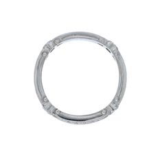 a white gold wedding ring on a white background