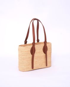 this stunning raffia handmade bag to our customers. This versatile bag can be used as both a shoulder bag and a handbag, making it the perfect accessory for any woman. The natural and eco-friendly raffia material used in this bag makes it a great choice for those who value sustainability. The bag comes in natural raffia color and black , so you can choose the one that best suits your personal style. Our skilled artisans have crafted this bag with traditional techniques and attention to detail, e Vacation Crochet Leather Bag With Woven Detail, Woven Leather Shoulder Bag For Vacation, Leather Woven Shoulder Bag For Vacation, Leather Shoulder Bag With Woven Detail For Vacation, Woven Leather Bags In Natural Color, Everyday Woven Leather Jute Shoulder Bag, Everyday Woven Leather Beach Bag With Double Handle, Everyday Double Handle Woven Leather Beach Bag, Leather Crochet Bag With Leather Handles For Vacation