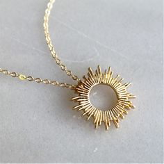 "This beautiful sun pendant necklace will be your favorite dainty jewelry!  Wear this as a reminder to always shine bright. Classic and elegant, it's perfect for everyday or as a meaningful gift.   D E T A I L S *15mm sun pendant. *14kt gold filled dainty link chain.  LENGTH *Please select from the drop down selection. *The standard length is normally 18\". *Model is wearing 18\" in Photos. HOW TO PERSONALIZE *Select your choices from the drop down menu to create your custom design. ∙ EXTRA LOVE Dainty Jewelry Necklace, Hope Is The Thing With Feathers, Necklace Sun, Always Shine, Sun Pendant, Dainty Gold Necklace, Dec 12, Scottsdale Az, Necklaces For Women