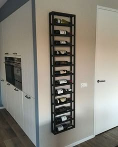 a wine rack in the corner of a kitchen