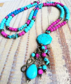 Bohemian tassel beaded necklace made with turquoise beads, turquoise  chips, pink lava beads, hand made beaded tasell,  brass charms. One-of-a-kind colorful bohochic long necklace You can wear on any ocasion. Go well specially in summer time. Hand made tassel make this item a little boho - hippy. Summer and turquoise go great together. It is wearable of course all year round. I'm sure you'll love to wear this unique peace of jewerly. Dimensions: -boho necklace is 55 cm long(with pendant) Thank y Affordable Bohemian Turquoise Necklace With Beaded Chain, Bohemian Hand-strung Turquoise Beaded Necklaces, Adjustable Bohemian Tassel Necklace With Colorful Beads, Bohemian Tassel Necklace With Colorful Round Beads, Bohemian Tassel Necklace With Colorful Beads, Bohemian Turquoise Necklace With Colorful Beads, Turquoise Beaded Jewelry For Festival, Bohemian Hand-strung Turquoise Necklace For Festivals, Adjustable Turquoise Tassel Necklace With Round Beads