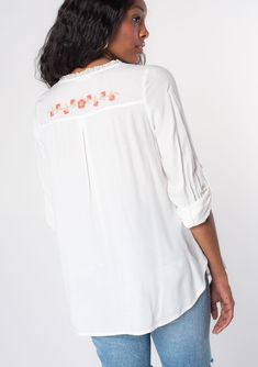 Looking for a Spring wardrobe refresh? This simple yet refined long sleeve bohemian blouse features a delicate self-covered button front, flattering split v-neckline, and floral embroidered detail. Wear it loose over denim, or try it tied in the front. Vintage floral embroidery Relaxed fit Long rolled sleeve with button tab closure Rounded hemline Side vents V-neckline Lace trim Self-covered button front Can be tied at the front Bohemian top Model is 5'9, wearing a size S.Style: I-13797W-RPX Feminine Embroidered V-neck Blouse, Long Sleeve Embroidered Top For Spring Daywear, Spring Flowy Blouse With Split Neck, Flowy Split Neck Blouse For Spring, Floral Embroidered V-neck Peasant Top For Spring, Feminine Long Sleeve Rayon Blouse, White Bohemian Blouse With Button Closure, Relaxed Fit V-neck Embroidered Top With Floral Embroidery, Relaxed Fit V-neck Top With Floral Embroidery