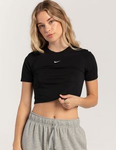 Nike Sportswear Essential Slim Crop Tee. Embroidered Nike Swoosh Logo On Center Chest. Ribbed Crew Neckline. Short Sleeve. Slim Fitting, Cropped Fit. 49% Polyester, 49% Modal, 2% Spandex. Machine Wash. Imported. Model Is Wearing A Size Small. Model Measurements:height: 5'8" Bust: 34"waist: 25"hips: 36" Nike Tshirts Women, Nike T Shirts Women, Nike Crop Top Outfits, Nike Outfits For Women, Nike Shirts Women, Cropped Tee Outfit, Nike Tops Women, Running Fits, Nike Women Outfits