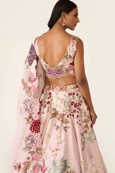 The pink lehenga is created with multicolor threadwork embroidery is embellished with sequin, cutdana, beads and stones. It is paired with classic blouse and dupatta with thread and bead work. Luxury Anarkali Blouse Piece In Pink, Luxury Summer Lehenga With Resham Embroidery, Luxury Pink Lehenga With Lace Work, Luxury Floral Embroidered Lehenga For Festive Occasions, Luxury Spring Georgette Lehenga, Affordable Pink Embroidered Traditional Wear, Luxury Pink Blouse With Unique Design, Luxury Floral Embellished Choli For Party, Luxury Pink Traditional Wear With Printed Motifs