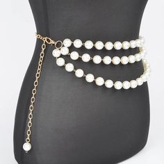 A sophisticated blend of elegance and style, the Multi Layered Pearl Gold Chain Belt is a statement accessory for any fashion-forward wardrobe. This exquisite piece features multiple layers of lustrous pearls intertwined with gleaming gold chains, creating a stunning contrast that catches the eye. Whether you're dressing up for a special occasion or adding a touch of glamour to your everyday outfit, this belt is sure to make a lasting impression. - 0.65" Wide x 47" Long - Imported Pearl Gold Chain, Gold Chain Belt, Scarf Gift, Chain Belt, Everyday Outfit, Pearl Chain, Multi Layering, Ring Necklace, Long Tops