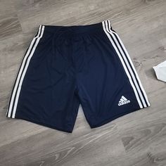 Mens Adidas Soccer Shorts Squad 21 Style Gn5775 Size Medium 100% Polyester Navy Blue Soccer Shorts With 3 White Stripes On Sides Aeroready Moisture Wicking Shorts Have No Pockets But Do Have An Elastic Waist & Drawstring. Navy Sports Bottoms With Three Stripes, Adidas Navy Sports Shorts, Adidas Sports Shorts, Adidas Soccer Shorts, Soccer Shorts, Adidas Soccer, Mens Adidas, Adidas Shorts, Blue Adidas