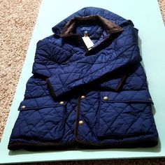 Color Is Navy. Stylish, Classic, Well-Made Jacket For Boys. Signature Embroidered Pony At The Left Chest. Button-Off Hood. Corduroy Point Collar. Snapped Placket. Corduroy Trim Along The Placket, Cuffs, Vent, And Hem. Two Front Waist Snapped Pockets. Double Vent With Snapped Closures. Winter Blue Quilted Jacket With Padded Collar, Blue Quilted Jacket For Fall Outdoor Activities, Blue Quilted Jacket For Fall Outdoor, Blue Quilted Outerwear For Outdoor, Blue Quilted Jacket For Outdoor Fall Activities, Blue Quilted Long Sleeve Jacket For Cold Weather, Blue Long Sleeve Quilted Jacket For Cold Weather, Blue Quilted Outdoor Outerwear, Blue Quilted Jacket With Padded Collar