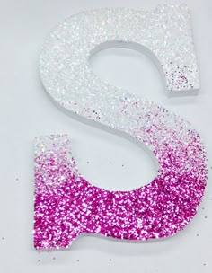 the letter s is decorated with pink and white glitter