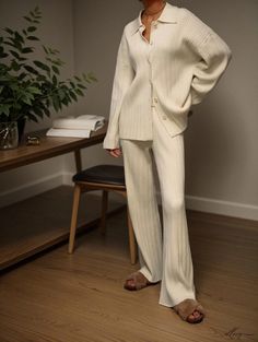 Elluis - Sophisticated Knitwear Ensemble: Coordinated Knitted Sweater, Wide-Leg Pants, and Open-Front Cardigan featuring Elegant Knit Patterns Cream Long Sleeve Sets For Fall, Elegant Knit Pants For Loungewear, Elegant Ribbed Pants For Fall, Elegant Loungewear Pants For Winter, Elegant Winter Loungewear Pants, Elegant Fall Loungewear Sets, Fitted Knitted Cardigan For Loungewear, Beige Knit Loungewear Sets, Elegant Winter Loungewear Sets