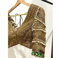 Traditional Luxury Gold Blouse, Luxury Bollywood Blouse With Intricate Embroidery, Luxury Diwali Blouse With Intricate Embroidery, Luxury Traditional Blouse With Handwork, Luxury Traditional Tops With Dabka Work, Luxury Blouse With Pallu For Celebration, Luxury Resham Embroidery Party Blouse, Elegant Luxury Blouse With Gota Work, Luxury Resham Embroidery Blouse For Evening