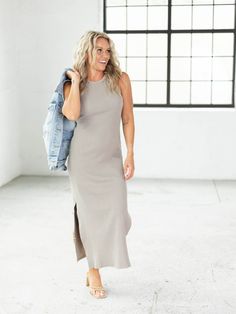 A micro ribbed fabrication leads down the length of this slightly fitted maxi dress. This new arrival has a higher, halter style neckline to add a merge of flirty + athleisure inspired vibes to this dress. More of a slimmer fitting silhouette, this maxi length dress can be styled for a variety of occasions. By Together Ribbed knit fabrication Higher neckline Slim fitting silhouette Maxi length Side vents 97% Cotton, 3% Spandex Body length measurement: 52" from a S. Bust measurement: 14.5" from a S. Model is wearing a S. Chic Ribbed Stretch Maxi Dress, Spring Ribbed Midi Length Maxi Dress, Sleeveless Stretch Ribbed Maxi Dress, Ribbed Stretch Sleeveless Maxi Dress, Ribbed Stretch Maxi Dress, Stretch Ribbed Maxi Dress, Casual Sleeveless Ribbed Maxi Dress, Casual Maxi Dress With Stretch Fit And Side Slits, Ribbed Stretch Maxi Dress For Summer