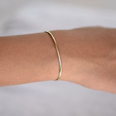 "14K gold cuff bracelet. 14K Gold Minimalist Cuff Bracelet, Delicate cuff bracelet. The bracelet will be shipped in a gift box * 14K solid gold. It is about 2.5mm width. Please select the size of your wrist. If your wrist is 6\", please purchase a 6\" bracelet. (If you order a 6\" bracelet, actual cuff length will be 5\" plus 1 inch opening.) Please read our policies before you place your order. https://www.etsy.com/shop/SashJewelry/policy?ref=shopinfo_policies_leftnav To see other Mother daught Minimalist Stackable Cuff Bangle Bracelet, Minimalist Stackable Cuff Bracelet As Gift, Minimalist Gold Bangle Bracelet For Formal Occasions, Minimalist Stackable Cuff Bracelet For Gift, Minimalist Stackable Cuff Bracelet Gift, Modern Stackable Bangle As A Gift, Simple Bangle Cuff Bracelet Gift, Simple Cuff Bangle Bracelet As Gift, Modern Yellow Gold Cuff Bracelet For Everyday