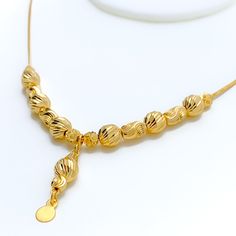 Weighing 10.2 grams, this 21k gold necklace showcases a decorative design with a radiant yellow gold finish, perfect for a dressy occasion. The 17-inch length provides a comfortable fit, while the 1.25-inch drop adds an elegant touch of sophistication. Secured with a lobster lock, this piece combines timeless beauty with intricate craftsmanship, making it an ideal accessory for special events or to elevate everyday style. PRODUCT DETAILS Gold Purity(karat): 21k Gold Weight(grams): 10.2 Item Fini Gold Bridal Necklace With Pendant And Elegant Design, Gold Necklaces With Elegant Pendant Design, Elegant Yellow Gold Plated Necklaces, Elegant Gold-plated Gold Necklace, Gold Clavicle Chain Bridal Pendant Necklace, Gold Bridal Pendant Necklace With Clavicle Chain, Elegant Gold-tone Necklace With Gold Beads, Elegant Yellow Gold Chain Necklace With Gold Beads, Elegant Bridal Necklace In Yellow Gold With Gold Beads