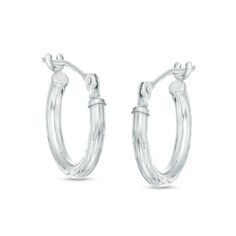 Details set these hoops apart from others. Fashioned in 14K white gold, each 13.0mm hoop earring boasts intricate diamond-cut detailing and a bright buffed finish. A great look any time, these hoops secure with hinged backs. Elegant Small Diamond Cut Hoop Earrings, White Gold Round Hoop Earrings For Pierced Ears, White Gold Round Hoop Earrings, Silver Diamond Cut Huggie Jewelry, Silver Huggie Jewelry With Diamond Cut, Oval Sterling Silver Hoop Earrings With Diamond Cut, Oval Diamond Cut Sterling Silver Hoop Earrings, Formal White Gold Hoop Earrings With Diamond Cut, Silver Small Hoop Earrings In Fine Jewelry Style