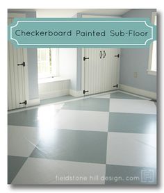 the checkerboard painted sub floor is white and gray with blue trim on it