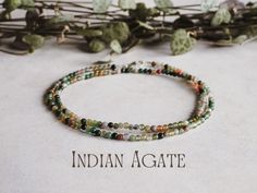 Indian Agate is the '𝗦𝘁𝗼𝗻𝗲 𝗼𝗳 𝗘𝘁𝗲𝗿𝗻𝗶𝘁𝘆' and is said to have the following properties: * Strengthens the body's connection to the earth * Brings luck and prosperity * Increases relaxation when meditating * Encourages emotional healing Delicately designed with a minimalist touch, these bracelets feature dainty 2mm round, smooth beads. Each piece is meticulously threaded on durable wire, ensuring resilience for everyday wear, while 8mm sterling silver clasps add a touch of elegance a Yoga Necklace, Indian Agate, Yoga Gifts, Necklace Minimalist, Green Crystal, Meditation Yoga, Beaded Choker, Emotional Healing, Green Crystals