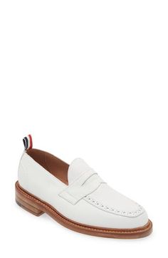 A tricolor grosgrain pull loop brings the label's signature flair to this calfskin-leather loafer detailed with classic broguing at the apron toe. Leather upper and lining/leather and synthetic sole Made in the UK Designer Shoes White Cap Toe Leather Shoes For Work, White Brogue Dress Shoes For Work, Workwear Wingtip Tassel Loafers In Calf Leather, White Leather Shoes With Brogue Detailing For Work, White Brogue Leather Shoes For Work, Wingtip Tassel Loafers With Brogue Detailing In Calf Leather, Wingtip Calf Leather Loafers For Work, White Calf Leather Loafers For Work, White Tassel Loafers With Brogue Detailing For Formal Occasions