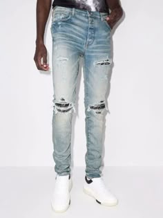 Amiri adds streetwear-inspired details to classic denim silhouettes for SS22, as showcased by this clay-indigo iteration of the MX1 jeans. Cut for a skinny fit, they feature ripped accents at the front and a distressed finish throughout. Denim Men, Kick Flare Jeans, Denim Quilt, Fashion Man, Patchwork Jeans, Patched Jeans, Bandana Print, Designer Jeans, Hip Hop Fashion