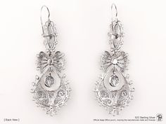 "Original Portuguese Filigree QUEEN Heart Earrings, Fashion Folk - Traditional Filigree Jewelry from Viana, Portugal - Brand-new (Unused). Very elegant and exclusive earrings, handmade by experienced Artisans and manufactured in 925 Sterling Silver. Item specifics: Model: Queen EARRINGS Reference: JM-BR002 Backing type: hook Material: 925 Sterling Silver Height: aprox. 6.5 cm (with hook) Weight: aprox. 7,5 grams Condition: Brand-new (Unused) Original Portuguese Traditional Filigree Jewelry - Han Ornate Sterling Silver Earrings With Elegant Design, Silver Diamond Earrings With Intricate Design For Wedding, Traditional Silver Earrings With Elegant Design, Traditional Sterling Silver Earrings With Elegant Design, Traditional Silver Diamond Earrings With Intricate Design, Silver Drop Earrings With Intricate Design, Antique Silver Earrings For Formal Occasion, Silver Victorian Earrings For Anniversary, Traditional Engraved Wedding Earrings