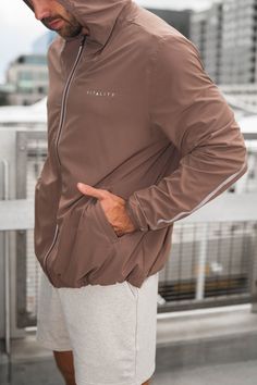 The Prime Windbreaker is the perfect layering piece to throw on top of your favorite outfit. This jacket offers functionality and comfort while also providing a sporty look to add to your wardrobe. Relaxed Fit Sportswear Outerwear With Long Sleeves, Casual Brown Nylon Outerwear, Athleisure Moisture-wicking Outerwear For Streetwear, Athleisure Outerwear With Moisture-wicking For Streetwear, Brown Functional Outerwear For Fall, Moisture-wicking Athleisure Outerwear For Streetwear, Sporty Stretch Track Jacket With Pockets, Urban Moisture-wicking Windbreaker For Gym, Sporty Brown Track Jacket With Long Sleeves