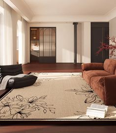 a living room filled with furniture and a large rug