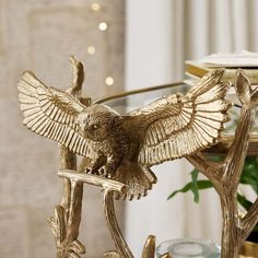 an eagle statue sitting on top of a table