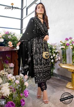 FABRIC: LAWNCOLOR: BLACK PRODUCT DETAILS Iqra slays in this classy noir ensemble brought to life by heavily done chickankari embroidery done in herringbone stitch adorned with 5 mm muted copper sequins and banarsi zari working wonders in this design. It comes with an embroidered chiffon dupatta and solid dyed pants.DESIGN DETAILS:1.25 meters Embroidered Jaal For Front on lawn (W 32" H 45")1 piece Embroidered Chan on lawn for back32” Embroidered border for front daaman32” Embroidered border for b Black Georgette Lawn Suit For Festive Occasions, Black Traditional Georgette Lawn Suit, Black Embroidered Set In Georgette, Traditional Black Georgette Lawn Suit, Black Georgette Lawn Suit With Dupatta, Black Traditional Wear With Chikankari Embroidery For Party, Black Georgette Sets With Intricate Embroidery, Black Set With Intricate Embroidery In Georgette, Black Sharara With Resham Embroidery