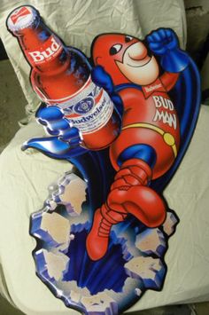 a toilet seat cover with a cartoon character on it and a beer bottle in the middle