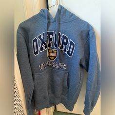 Never Worn, Like New Oxford University Hoodie Thick And Very Nice Quality Official Merchandise Quality Embroidery Oxford University Sweatshirt, Blue Cotton Hoodie With Embroidered Logo, Blue Long Sleeve Sweatshirt With Embroidered Logo, Collegiate Blue Top With Embroidered Logo, Blue Fleece Tops With Embroidered Logo, Blue Varsity Sweatshirt With Embroidered Logo, Blue Hoodie With Embroidered Logo, Blue Crew Neck Hoodie With Embroidered Logo, Blue Hoodie With Embroidered Logo For Winter