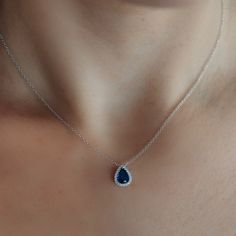 This stunning sapphire necklace is set in 18K white gold and surrounded by natural diamonds. It is stunning enough to impress while being perfectly sized for everyday wear. The 16-inch gold chain allows the pendant to lay at or just below the hollow of your throat. Wear with our matching ring, bracelet, and earrings. Natural Blue Sapphire: 0.90cts Natural Diamonds: 0.10ctw 18K White Gold Necklace Length: 16 Inches Blue Drop Jewelry With Diamond Accents, Blue Teardrop Pendant Jewelry With Diamond Accents, Blue Teardrop Pendant With Diamond Accents, Elegant Blue Diamond Pendant Necklace, Elegant Blue Teardrop Necklace, Luxury Blue Diamond Pendant Necklace, Luxury Blue Diamond-cut Necklace, Pear-shaped Blue Diamond Jewelry, Luxury Blue Pendant Diamond Necklace