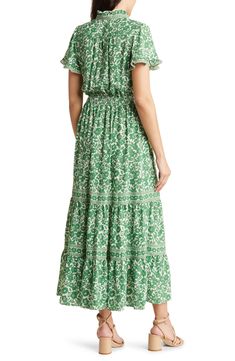 A smocked waist defines the silhouette of a maxi dress finished in a bold pattern for eye-catching appeal. 52 3/4" length Front button closure Split neck Short sleeves 100% polyester Machine wash, line dry Imported