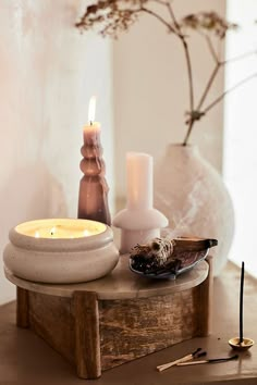 a table with candles and other items on it