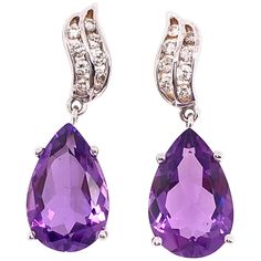 14 Kt White Gold Earrings with Diamonds And Amethysts 0.50 Total Diamond Weight 4.79 grams total weight. Luxury Amethyst Teardrop Earrings, Formal Amethyst Gemstone Earrings, Amethyst Earrings Fine Jewelry For Formal Occasions, Amethyst Gemstone Earrings For Formal Occasions, Purple Fine Jewelry Earrings For Formal Occasions, Elegant Purple Teardrop Gemstone, Formal Amethyst Briolette Earrings, Amethyst Briolette Earrings For Formal Occasions, White Gold Amethyst Earrings Fine Jewelry