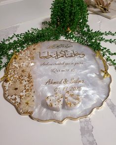 the wedding cake is decorated in gold and white