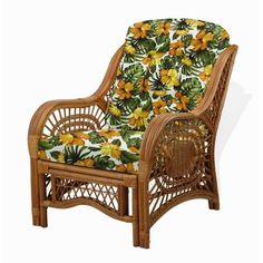 a wicker chair with yellow flowers and green leaves on it's seat cushion