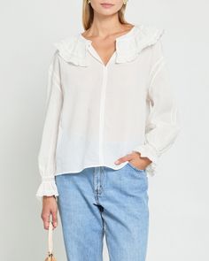 Product Details The Kalliope Top features a peasant sleeve with a delicate ruffle and a ruffled collar accented with lace detailing. The front button at the neck allows for versatile styling options, while the breezy fabric ensures comfort. Elevate your wardrobe with this feminine and versatile top. - Front button- Content: 100% Cotton Style# C23WTP06039 Fit Notes - Model wearing a size XS - Model measurements: 5'10'' Height / 32'' Bust / 24'' Waist / 34'' Hips- Garment measurements: Size Length Chic Blouse With Broderie Anglaise And Ruffled Collar, Chic Tops With Broderie Anglaise And Ruffled Collar, Feminine Tops With Broderie Anglaise And Ruffled Collar, White Swiss Dot Top For Fall, Feminine Ruffled Peasant Top For Daywear, Elegant Ruffled Peasant Top For Daywear, Chic Ruffled Peasant Top For Daywear, White Ruffled Collar Blouse For Daywear, Feminine Long Sleeve Peasant Top With Ruffles