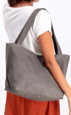 ▼Designer Tote Bag | Shiri Tote This Designer Tote Bag is perfect for any stylish woman! It's made from the finest full grain high-quality Italian leather, and comes in various colors to match your personal style.The spacious interior of this tote will protect all of your essentials. Plus it features two pockets inside to keep everything secure no matter what it is!A designer tote bag is the perfect everyday bag! It's big enough to fit everything you need, but not so much that carrying it around Minimalist Textured Leather Shoulder Bag For Travel, Rectangular Hobo Bag For Travel With Smooth Grain, Textured Leather Tote Travel Bag, Everyday Textured Leather Satchel Travel Bag, Everyday Textured Leather Satchel Backpack, Rectangular Textured Leather Hobo Bag For Travel, Leather Minimalist Hobo Bag For Travel, Everyday Textured Leather Satchel Weekender Bag, Minimalist Leather Hobo Bag For Travel