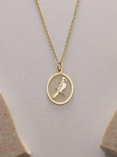 Gold Cardinal Bird Pendant - Bird Gold Necklace ● Material of pendant: Solid Gold 14k ( REAL GOLD ) ● Metal Stamp: 14k ( REAL GOLD ) ● The pendant is available in 5 sizes: - 12x17 mm / 0,47 x 0,66 inches - 13x18 mm / 0,51 x 0,70 inches  In the photos - 14x19 mm / 0,55 x 0,74 inches  - 16x21 mm / 0,62 x 0,82 inches  - 18x24 mm / 0,70 x 0,94 inches ( In the photos the size is 13x18 mm / 0,51 x 0,70 inches ) ( Jump Ring inner diameter: 4 mm ) ● Material of chain: Solid gold 14k ( REAL GOLD ) It is thin and dainty and it is available in 4 sizes: - 40 cm / 15,75 inches ( Length ) - 45 cm / 17,72 inches ( Length ) In the photos - 50 cm / 19,68 inches ( Length ) - 55 cm / 21,65 inches ( Length ) ● Backside engraving is FREE ( Please use the personalization box for that.) ● If you want larger size Bird Design Necklace Perfect For Gifts, Bird Design Necklace As A Gift, Bird Design Necklace For Gift, Bird-shaped Bird-design Necklace For Gifts, Necklace With Round Pendant And Bird Design For Gifts, Round Necklace With Bird Design For Gift, Yellow Gold Bird Design Pendant Jewelry, Round Pendant Necklace With Bird Design For Gift, Bird Design Necklace Gift