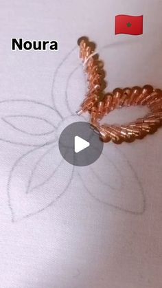 a video showing how to make a beaded ring with noura beads and wire