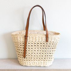 Elena Handbags Straw Basket Tote Bag Straw Basket, Basket Tote, Los Angeles Fashion, Woven Tote Bag, Los Angeles Style, Vintage Vibes, White Bag, Leather Handle, Beach Bag