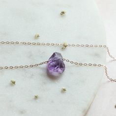 Amethyst in its most raw state. These stones come straight from Africa and their high-quality makes the Amethyst a pure clarity that can't be compared. This pendant necklace is the perfect gift for a February birthstone present, Christmas gift, or just snag it for yourself! (you deserve it♥) ♥ M A T C H I N G E A R R I N G S ♥ Find the matching Raw Amethyst earrings here: https://www.etsy.com/listing/707923896/amethyst-earrings-studs-february?ref=shop_home_active_12&pro=1&frs=1 *Message Purple Amethyst Necklace With Raw Stone, Amethyst Raw Stone Necklace For Healing, Purple Raw Stone Necklace For Gift, Purple Amethyst Jewelry With Raw Stones, Dainty Amethyst Crystal Necklace For Gift, Purple Raw Stone Necklaces For Healing, Amethyst Earrings Studs, Raw Amethyst Crystal, February Birthstone Necklace