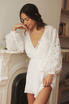 Wrap yourself in the ethereal embrace of the Rya Collection Milos Cover-Up Robe, where delicate lace whispers secrets of summer nights. | Milos Lace-Sleeve Cover-Up Robe by Rya Collection in White, Women's, Size: Medium/Large, Polyester at Anthropologie Strapless Robe, Night Robe Lace, Plus Size Honeymoon Night, White Robes Bride, Bridal Getting Ready Loungewear, Wedding Pajamas Dress, Bridal Get Ready Robes, Wedding Silk Robes, Robe Over Wedding Dress