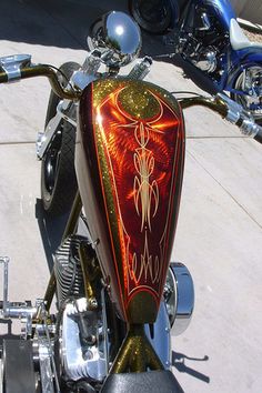 a close up of a motorcycle parked on the street