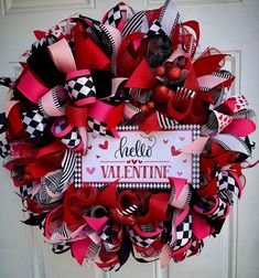 This beautiful Mesh and Ribbon wreath will bring a charming look to your door or home decor. It will arrive as pictured. The picture shows this wreath in the 22 inch size. All finished wreaths are measured from outside edge to outside edge for the diameter size. All wreaths have a wire on back to allow for hanging.  If you have any questions or would like to custom order a wreath, please contact me. I love to customize orders! I can certainly do my best to mix and match different colors.  To add a monogram or a different sign, please message me.  To check out my other burlap, grapevine and mesh wreaths, please click here: https://www.etsy.com/shop/TreasuresByDestani If you would like me to add the first coat of UV spray on your wreath, please let me know. I highly recommend that you purcha Mesh And Ribbon Wreath, Heart Wreaths, Valentine Wreaths, Valentines Day Wreath, Valentines Wreath, Black Wreath, Wreath Burlap, Different Signs, Valentine Day Wreaths