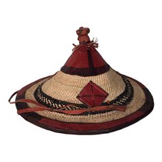 This beautiful woven hat is made by talented craftsmen living in Accra and it's surrounding villages. It's made using dried grass and leather and is popular known as Fulani hat. MEASUREMENTS Diameter: 15 inches Wide Height: 12 inches USES This hat is ideal to compliment your fashion sense and also, to prevent direct sunlight from burning your head. It's a free size hat and anyone can wear it whether a small or big head. Please do not hesitate to contact me if you have any concerns. Artisan Brown Hat For Beach, Handwoven Brown Wide Brim Straw Hat, Handwoven Brown Wide Brim Hats, Artisan Wide Brim Natural Hat, Artisan Wide Brim Hat In Natural Color, Brown Handwoven Wide Brim Hat, African Hat, Traditional Curved Brim Beach Hat, Brown Handwoven Festival Hat