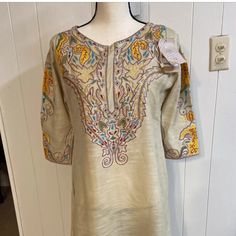 Pakistani Indian Kameez .Brand Gul Ahmed.Fabric Khader. Embroidered Kurta.Size Small .Made In Pakistan.Color Beige.Condition Is New With Tags. Resham Embroidery V-neck Tops For Eid, V-neck Tops With Resham Embroidery For Eid, Traditional Straight Kurta Top With Embroidery, Casual Fitted Tops With Resham Embroidery, Multicolor Embroidered Kurta With Long Sleeves, Casual Embroidered Short Sleeve Kurta, Embroidered Multicolor Tops For Eid, Fitted Straight Kurta With Floral Embroidery, Casual Fitted Kurta With Floral Embroidery